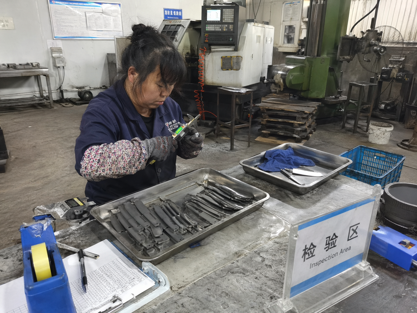 TOP KNIVES LLC sourcing desk with product samples and quote notes